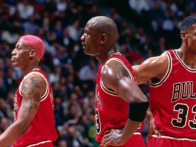 EAST RUTHERFORD, NJ - APRIL 11: Dennis Rodman #91, Michael Jordan #23, and Scottie Pippen #33 of the Chicago Bulls during the game against the New Jersey Nets on April 11, 1996 at Brendan Byrne Arena in East Rutherford, New Jersey. NOTE TO USER: User expressly acknowledges and agrees that, by downloading and/or using this photograph, user is consenting to the terms and conditions of the Getty Images License Agreement. Mandatory Copyright Notice: Copyright 1996 NBAE