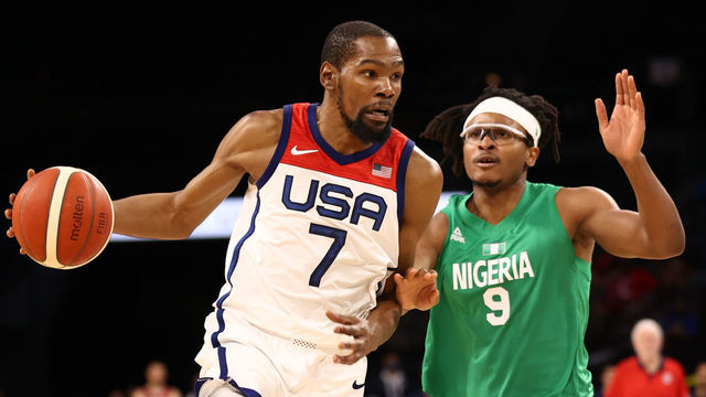 LAS VEGAS, NV - JULY 10: Chima Moneke #9 of the Nigeria Men's National Team plays defense on Kevin Durant #7 of the USA Men's National Team during the game on July 10, 2021 at Michelob ULTRA Arena in Las Vegas, Nevada.