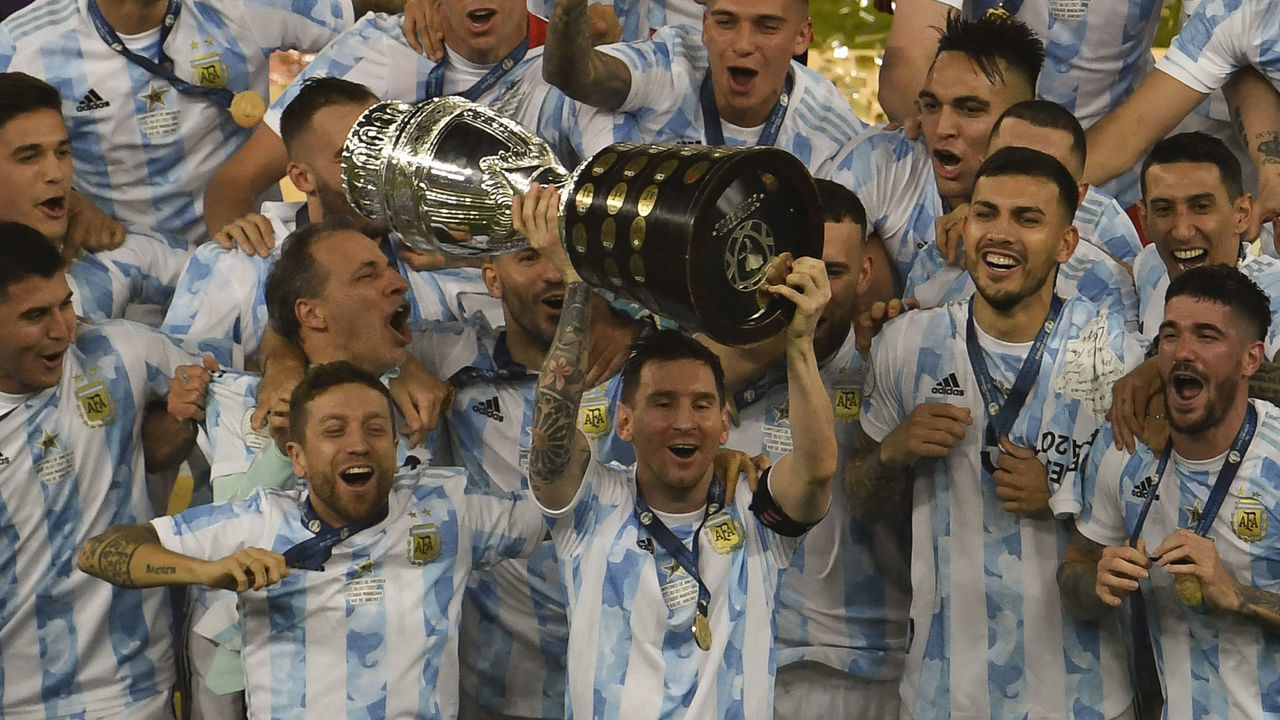 Argentina's Lionel Messi holds the trophy after winning the Conmebol 2021 Copa America football tournament final match against Brazil at Maracana Stadium in Rio de Janeiro, Brazil, on July 10, 2021.
