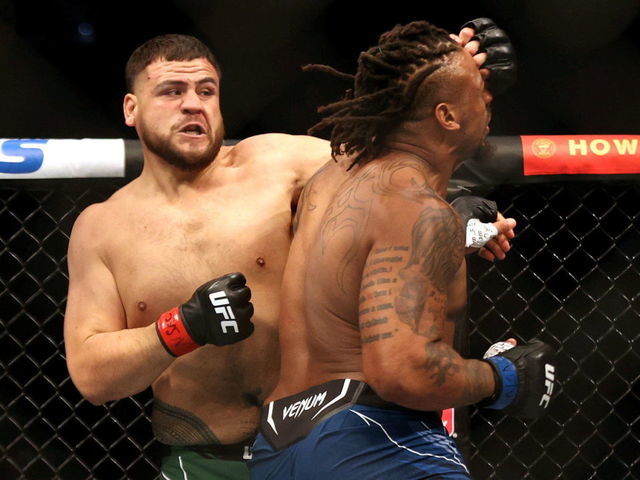 Nevada , United States - 10 July 2021; Tai Tuivasa lands a punch on Greg Hardy in their heavyweight fight during the UFC 264 event at T-Mobile Arena in Las Vegas, Nevada, USA.