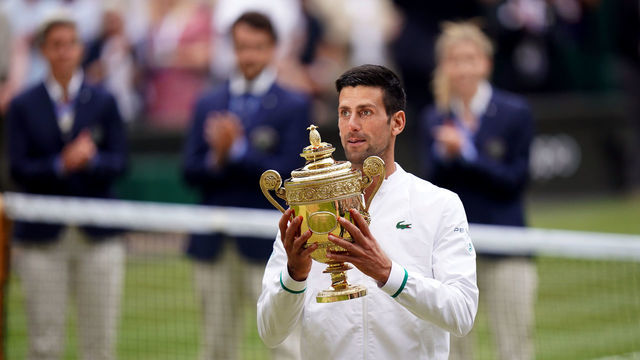 Novak Djokovic with the trophy after winning the Gentlemen's Singles final against Matteo Berrettini on day thirteen of Wimbledon at The All England Lawn Tennis and Croquet Club, Wimbledon. Picture date: Sunday July 11, 2021.