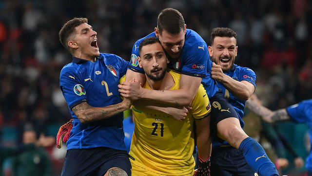 Italy's goalkeeper Gianluigi Donnarumma (C) celebrates with teammates after winning the UEFA EURO 2020 final football match between Italy and England at the Wembley Stadium in London on July 11, 2021.