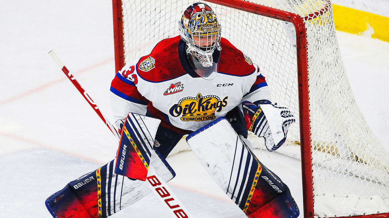 CALGARY, AB - MARCH 27: Sebastian Cossa #33 of the Edmonton Oil Kings in action against the Calgary Hitmen during a WHL game at Seven Chiefs Sportsplex on March 27, 2021 in Calgary, Alberta, Canada.