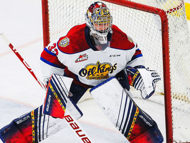 CALGARY, AB - MARCH 27: Sebastian Cossa #33 of the Edmonton Oil Kings in action against the Calgary Hitmen during a WHL game at Seven Chiefs Sportsplex on March 27, 2021 in Calgary, Alberta, Canada.