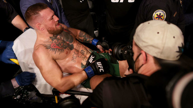 LAS VEGAS, NEVADA - JULY 10: Conor McGregor of Ireland is carried out of the arena on a stretcher after injuring his ankle in the first round of his lightweight bout against Dustin Poirier during UFC 264: Poirier v McGregor 3 at T-Mobile Arena on July 10, 2021 in Las Vegas, Nevada.