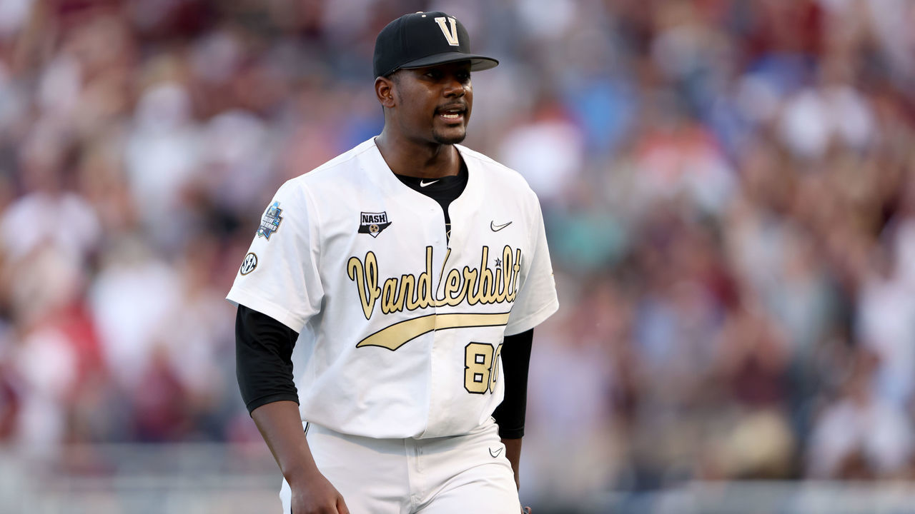 OMAHA, NEBRASKA - JUNE 30: Starting pitcher Kumar Rocker #80 of the Vanderbilt reacts to being pulled from the game against Mississippi St. by Head Coach Tim Corbin of the Vanderbilt in the top of the fifth inning during game three of the College World Series Championship at TD Ameritrade Park Omaha on June 30, 2021 in Omaha, Nebraska.