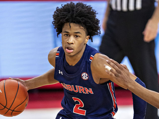 FAYETTEVILLE, ARKANSAS - JANUARY 20: Sharife Cooper #2 of the Auburn Tigers drives to the basket in the second half against the Arkansas Razorbacks at Bud Walton Arena on January 20, 2021 in Fayetteville, Arkansas. The Razorbacks defeated the Tigers 75-73.