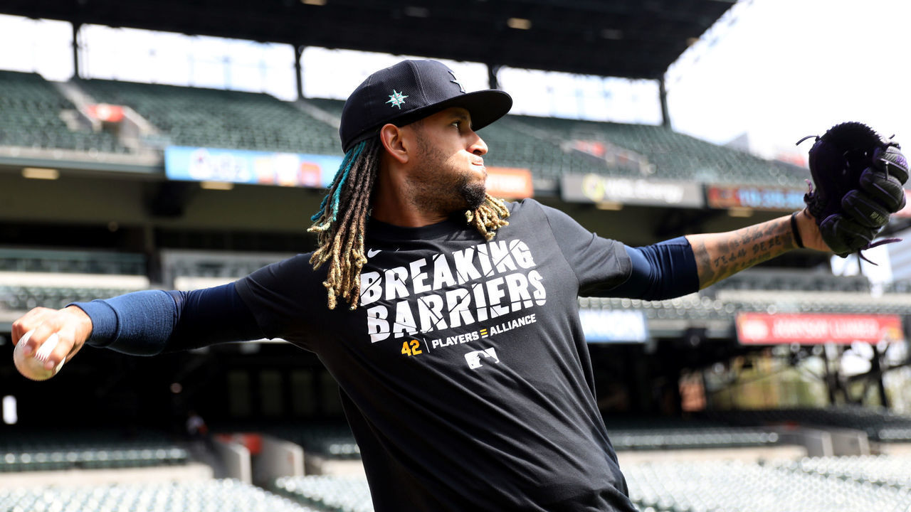 BALTIMORE, MD - APRIL 15: Keynan Middleton #42 of the Seattle Mariners warms up in the outfield while wearing a Players Alliance Breaking Barriers t-shirt during batting practice prior to the game between the Seattle Mariners and the Baltimore Orioles at Oriole Park at Camden Yards on Thursday, April 15, 2021 in Baltimore, Maryland.