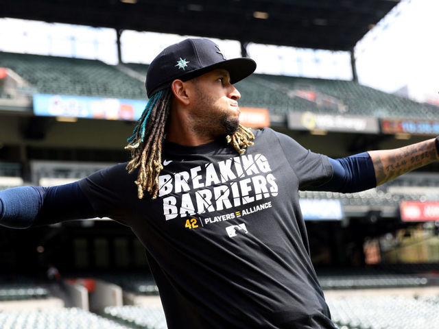BALTIMORE, MD - APRIL 15: Keynan Middleton #42 of the Seattle Mariners warms up in the outfield while wearing a Players Alliance Breaking Barriers t-shirt during batting practice prior to the game between the Seattle Mariners and the Baltimore Orioles at Oriole Park at Camden Yards on Thursday, April 15, 2021 in Baltimore, Maryland.