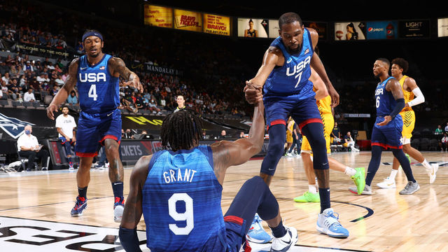 LAS VEGAS, NV - JULY 12: Bradley Beal #4 and Kevin Durant #7 help up Jerami Grant #9 of the USA Men's National Team during the game against the Australia Men's National Team on July 12, 2021 at Michelob ULTRA Arena in Las Vegas, Nevada.