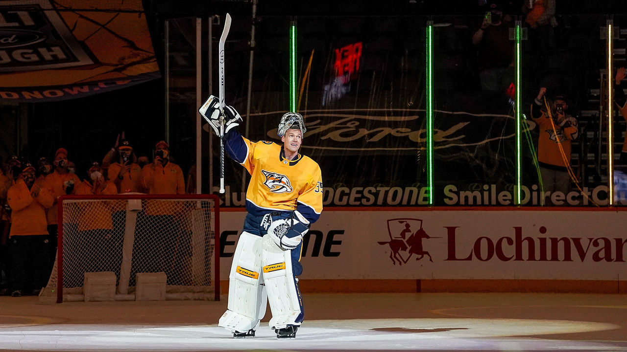 NASHVILLE, TN - MAY 10: Pekka Rinne #35 of the Nashville Predators is celebrated by his teammates and fans after a 5-0 win against the Carolina Hurricanes at Bridgestone Arena on May 10, 2021 in Nashville, Tennessee.