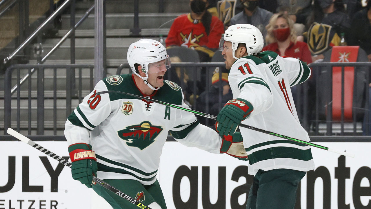 LAS VEGAS, NEVADA - MAY 28: Ryan Suter #20 and Zach Parise #11 of the Minnesota Wild celebrate after Suter assisted Parise on a first-period goal against the Vegas Golden Knights in Game Seven of the First Round of the 2021 Stanley Cup Playoffs at T-Mobile Arena on May 28, 2021 in Las Vegas, Nevada.