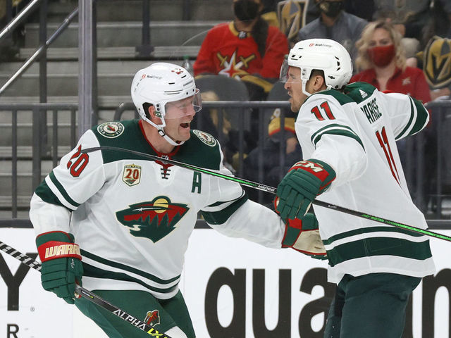 LAS VEGAS, NEVADA - MAY 28: Ryan Suter #20 and Zach Parise #11 of the Minnesota Wild celebrate after Suter assisted Parise on a first-period goal against the Vegas Golden Knights in Game Seven of the First Round of the 2021 Stanley Cup Playoffs at T-Mobile Arena on May 28, 2021 in Las Vegas, Nevada.