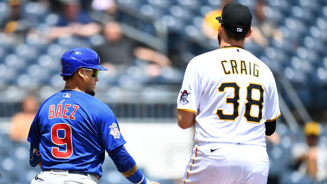PITTSBURGH, PA - MAY 27: Javier Baez #9 of the Chicago Cubs is caught in a rundown between home plate and first base by Will Craig #38 of the Pittsburgh Pirates during the third inning at PNC Park on May 27, 2021 in Pittsburgh, Pennsylvania.