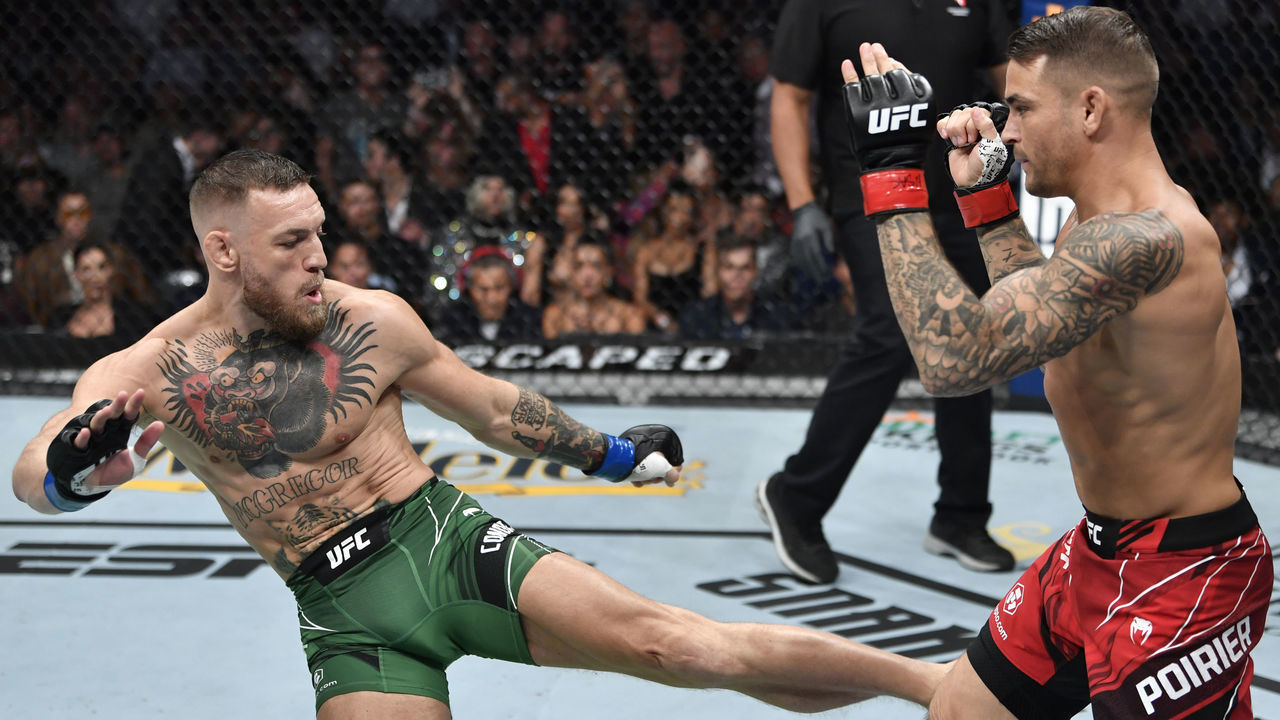 LAS VEGAS, NEVADA - JULY 10: (L-R) Conor McGregor of Ireland kicks Dustin Poirier in their welterweight fight during the UFC 264 event at T-Mobile Arena on July 10, 2021 in Las Vegas, Nevada.