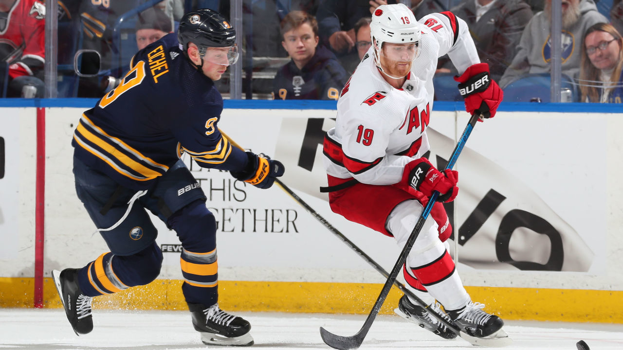 BUFFALO, NY - NOVEMBER 14: Jack Eichel #9 of the Buffalo Sabres skates against Dougie Hamilton #19 of the Carolina Hurricanes during an NHL game on November 14, 2019 at KeyBank Center in Buffalo, New York.