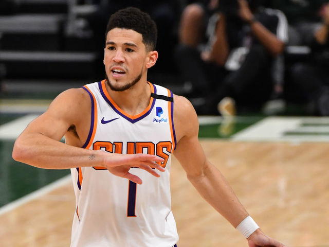 Devin Booker of the Phoenix Suns looks on during the game against the News  Photo - Getty Images 