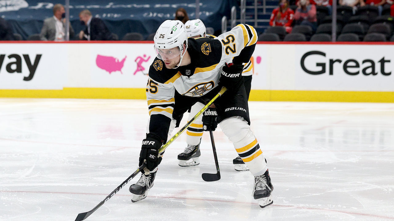 WASHINGTON, DC - MAY 23: Brandon Carlo #25 of the Boston Bruins follows the puck against the Washington Capitals during Game Five of the 2021 Stanley Cup Playoffs at Capital One Arena on May 23, 2021 in Washington, DC.