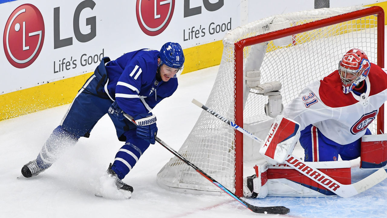TORONTO, ON - MAY 27: Toronto Maple Leafs Right Wing Zach Hyman (11) attempts a wrap around on Montreal Canadiens Goalie Carey Price (31) during Game Five of the Stanley Cup Playoffs First Round between the Montreal Canadiens and Toronto Maple Leafs on May 27, 2021 at Scotiabank Arena in Toronto, ON.