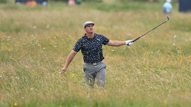 US golfer Bryson DeChambeau gestures from the deep rough on the 15th hole during his first round on day one of The 149th British Open Golf Championship at Royal St George's, Sandwich in south-east England on July 15, 2021. - RESTRICTED TO EDITORIAL USE
