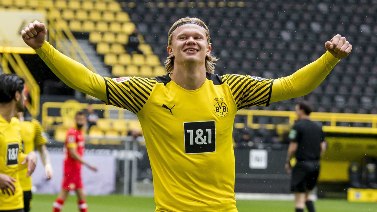 DORTMUND, GERMANY - MAY 22: Erling Haaland of Borussia Dortmund celebrates scoring the opening goal during the Bundesliga match between Borussia Dortmund and Bayer 04 Leverkusen at the Signal Iduna Park on May 22, 2021 in Dortmund, Germany.