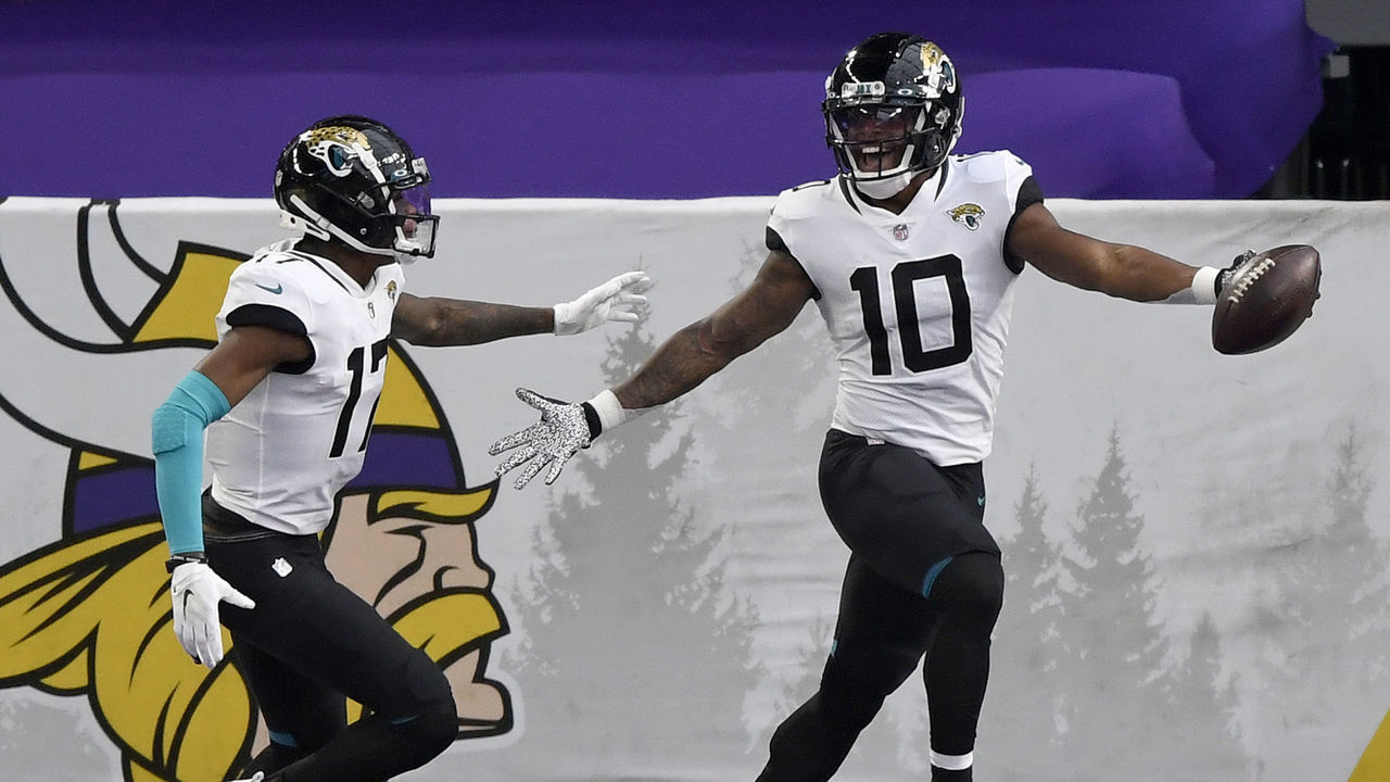 MINNEAPOLIS, MINNESOTA - DECEMBER 06: Laviska Shenault Jr. #10 of the Jacksonville Jaguars celebrates his touchdown with teammate D.J. Chark #17 in the first quarter against the Minnesota Vikings at U.S. Bank Stadium on December 06, 2020 in Minneapolis, Minnesota.