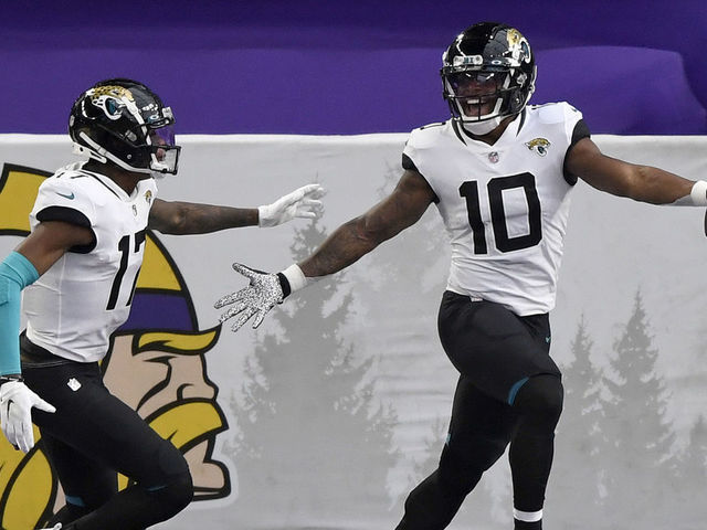 MINNEAPOLIS, MINNESOTA - DECEMBER 06: Laviska Shenault Jr. #10 of the Jacksonville Jaguars celebrates his touchdown with teammate D.J. Chark #17 in the first quarter against the Minnesota Vikings at U.S. Bank Stadium on December 06, 2020 in Minneapolis, Minnesota.