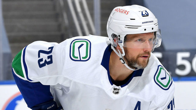 EDMONTON, AB - MAY 8: Alexander Edler #23 of the Vancouver Canucks awaits a face-off during the game against the Edmonton Oilers on May 8, 2021 at Rogers Place in Edmonton, Alberta, Canada.