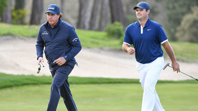 PEBBLE BEACH, CA - FEBRUARY 07: Phil Mickelson and Patrick Reed walk together by the eighteenth hole green during the first round of the AT&T Pebble Beach Pro-Am at Monterey Peninsula Country Club, on February 7, 2019 in Pebble Beach, California.
