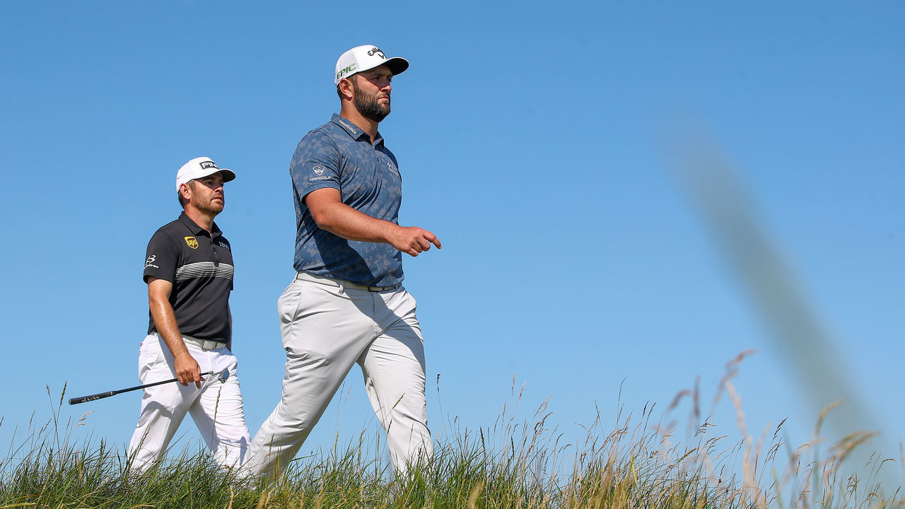 SANDWICH, ENGLAND - JULY 16: Louis Oosthuizen of South Africa and Jon Rahm of Spain walking off of the 6th tee during Day Two of The 149th Open at Royal St George’s Golf Club on July 16, 2021 in Sandwich, England.