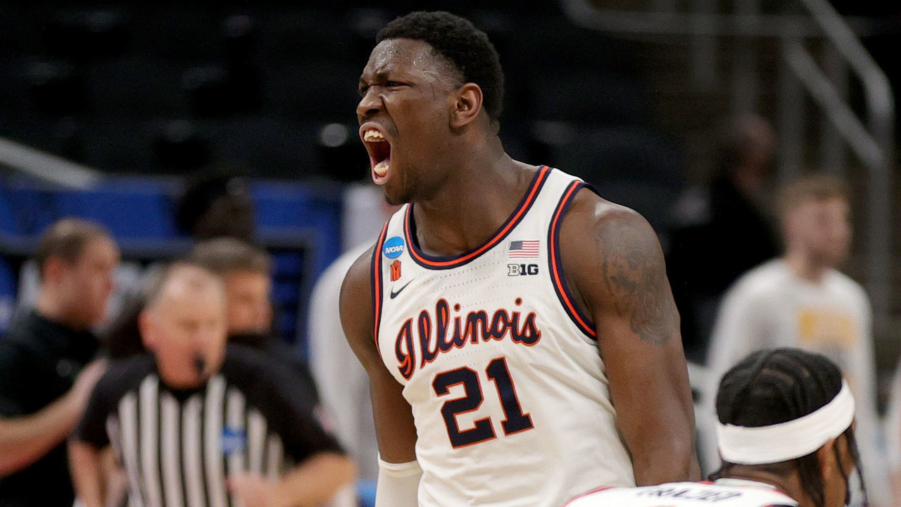INDIANAPOLIS, INDIANA - MARCH 21: Kofi Cockburn #21 of the Illinois Fighting Illini reacts to a basket against the Loyola Chicago Ramblers during the first half in the second round game of the 2021 NCAA Men's Basketball Tournament at Bankers Life Fieldhouse on March 21, 2021 in Indianapolis, Indiana.