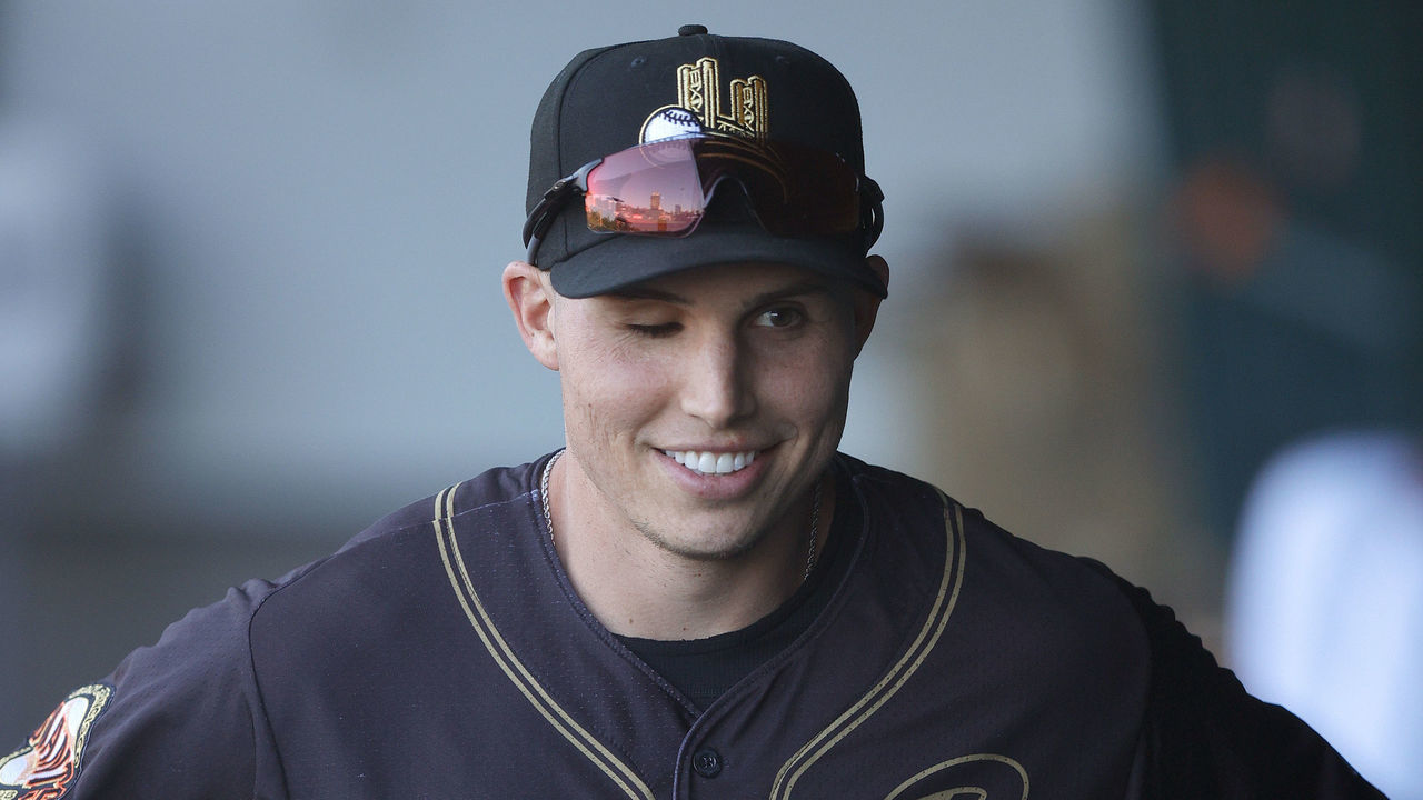 SACRAMENTO, CALIFORNIA - MAY 27: Drew Robinson #5 of the Sacramento River Cats gets ready in the dugout before their game against the Las Vegas Aviators at Sutter Health Park on May 27, 2021 in Sacramento, California. Robinson attempted suicide on April 16, 2020 by shooting himself in the temple. Although he lost vision in one of his eyes, he has been able to make a full recovery.