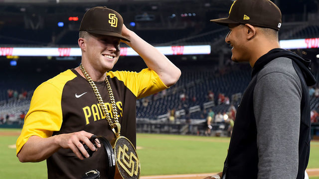 WASHINGTON, DC - JULY 16: Jake Cronenworth #9 of the San Diego Padres celebrates with Manny Machado #13 after hitting for the cycle and defeating the Washington Nationals at Nationals Park on July 16, 2021 in Washington, DC.