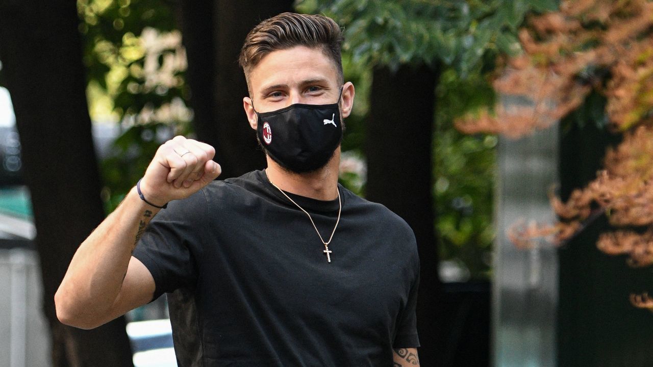 New AC Milan centre-forward, France's Olivier Giroud gestures upon his arrival at La Madonnina clinic in Milan on July 16, 2021 to undergo a medical check up. - The 34-year-old World Cup winner is reported to be set to sign a two-year contract worth three million euros per season with AC Milan.