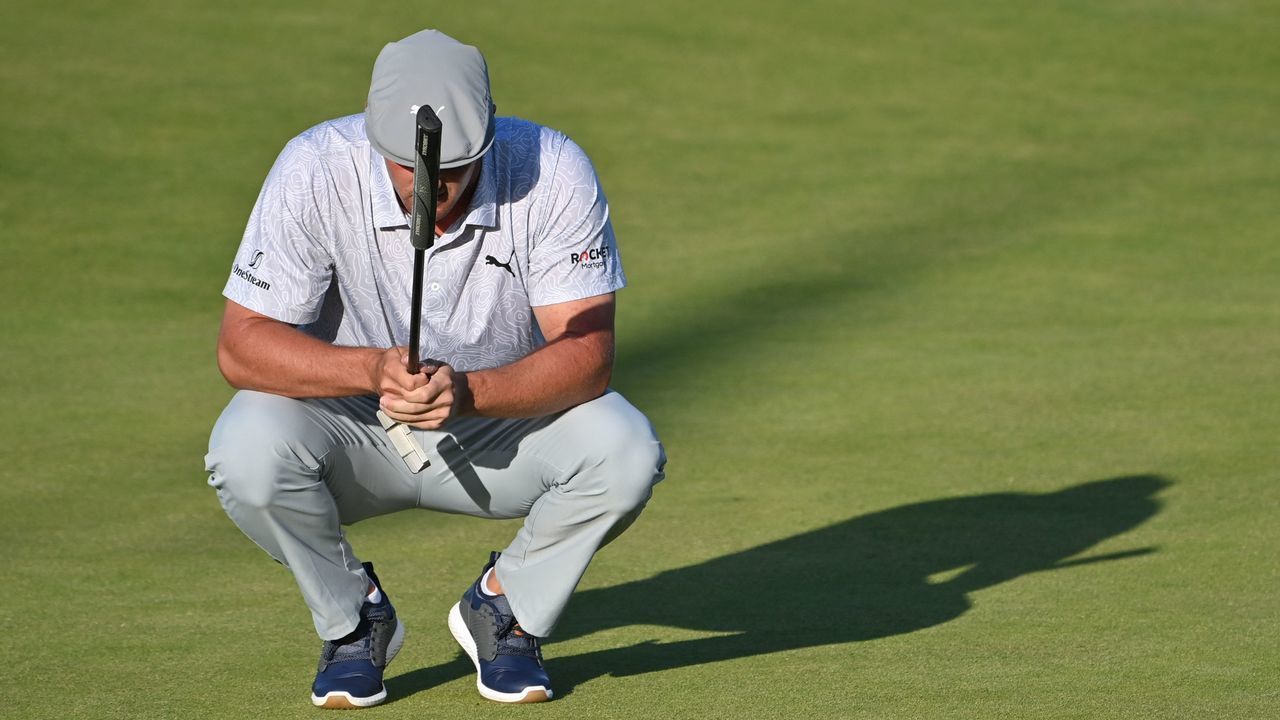 US golfer Bryson DeChambeau lines up a putt on the 18th during his second round on day 2 of The 149th British Open Golf Championship at Royal St George's, Sandwich in south-east England on July 16, 2021. - RESTRICTED TO EDITORIAL USE