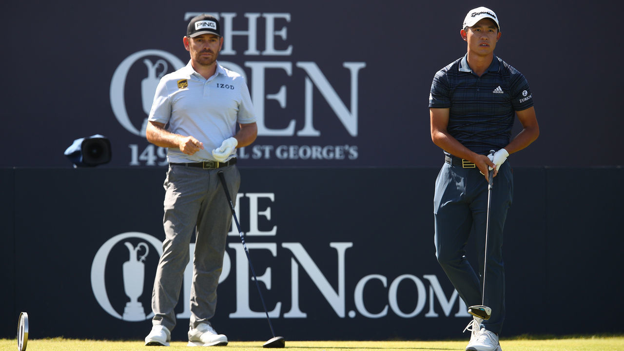 SANDWICH, ENGLAND - JULY 17: Louis Oosthuizen of South Africa and Collin Morikawa of the United States look on from the first tee during Day Three of The 149th Open at Royal St George’s Golf Club on July 17, 2021 in Sandwich, England.