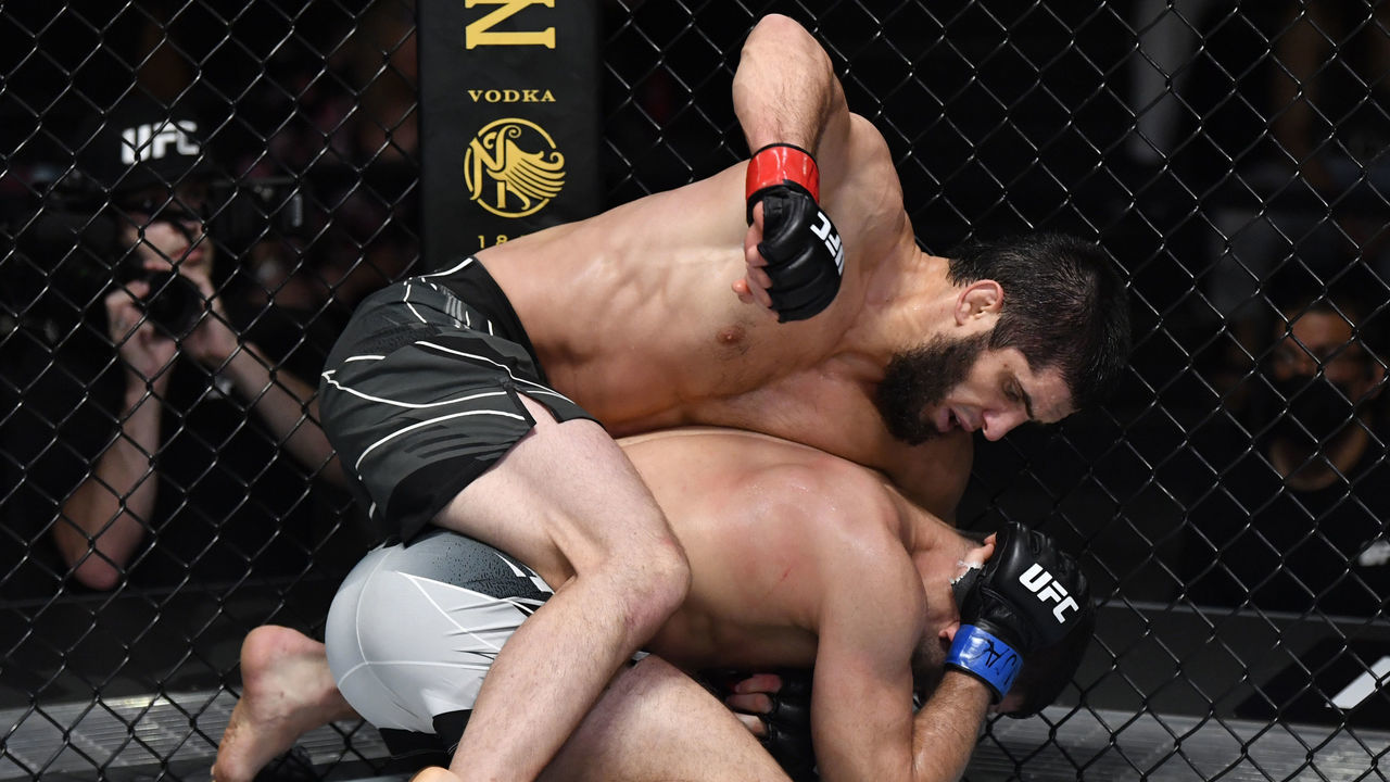 LAS VEGAS, NEVADA - JULY 17: (L-R) Islam Makhachev of Russia punches Thiago Moises of Brazil in their lightweight bout during the UFC Fight Night event at UFC APEX on July 17, 2021 in Las Vegas, Nevada.