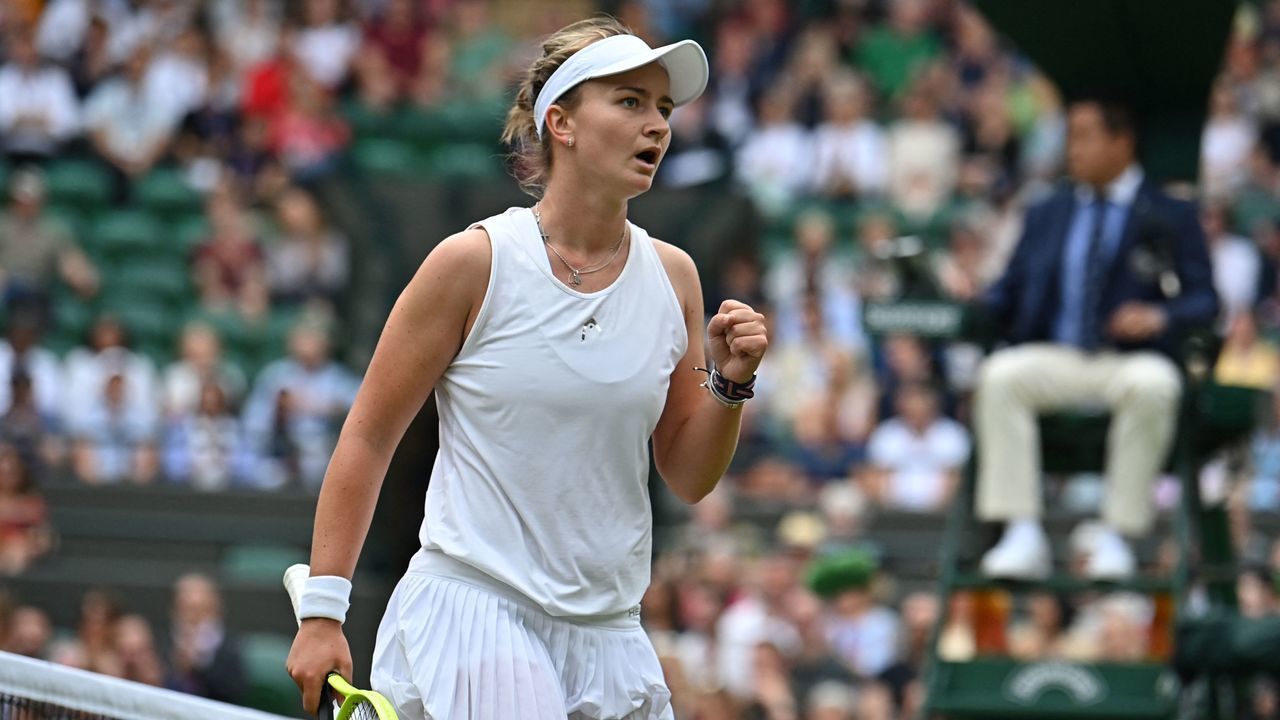Czech Republic's Barbora Krejcikova reacts while playing Australia's Ashleigh Barty during their women's singles fourth round match on the seventh day of the 2021 Wimbledon Championships at The All England Tennis Club in Wimbledon, southwest London, on July 5, 2021. - RESTRICTED TO EDITORIAL USE