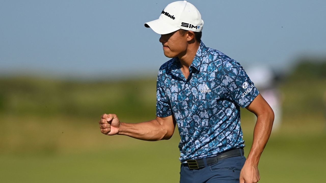 US golfer Collin Morikawa celebrates after a put on the 14th green during his final round on day 4 of The 149th British Open Golf Championship at Royal St George's, Sandwich in south-east England on July 18, 2021. - RESTRICTED TO EDITORIAL USE