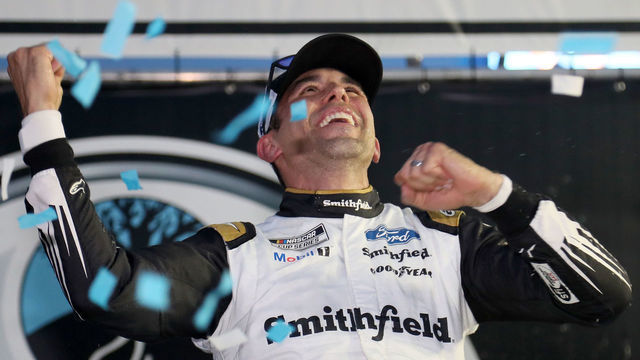 LOUDON, NEW HAMPSHIRE - JULY 18: Aric Almirola, driver of the #10 Smithfield Ford, celebrates in victory lane after winning the NASCAR Cup Series Foxwoods Resort Casino 301 at New Hampshire Motor Speedway on July 18, 2021 in Loudon, New Hampshire.