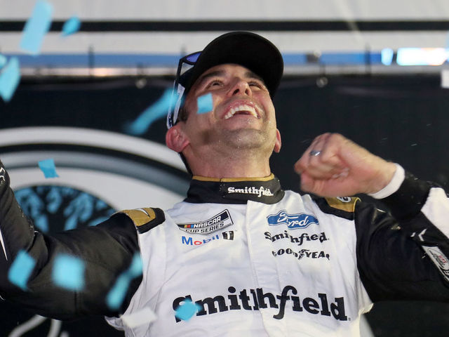 LOUDON, NEW HAMPSHIRE - JULY 18: Aric Almirola, driver of the #10 Smithfield Ford, celebrates in victory lane after winning the NASCAR Cup Series Foxwoods Resort Casino 301 at New Hampshire Motor Speedway on July 18, 2021 in Loudon, New Hampshire.