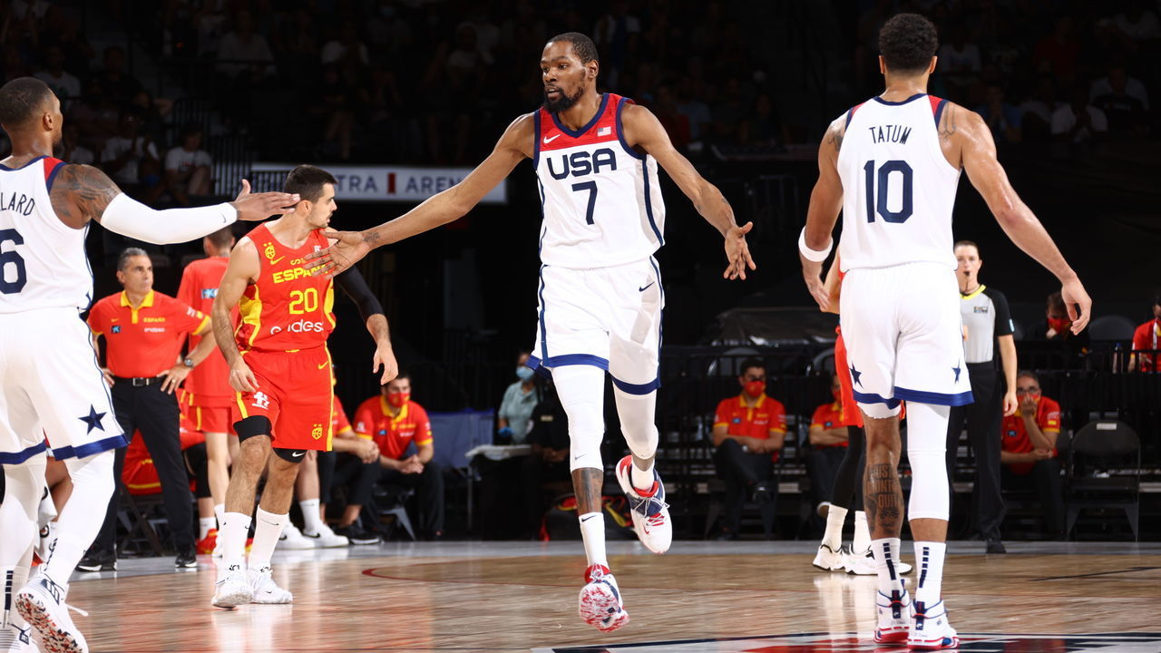 LAS VEGAS, NV - JULY 18: Kevin Durant #7 of the USA Men's National Team high fives Damian Lillard #6 of the USA Men's National Team and Jayson Tatum #10 of the USA Men's National Team during the game against the Spain Men's National Team on July 18, 2021 at Michelob ULTRA Arena in Las Vegas, Nevada.