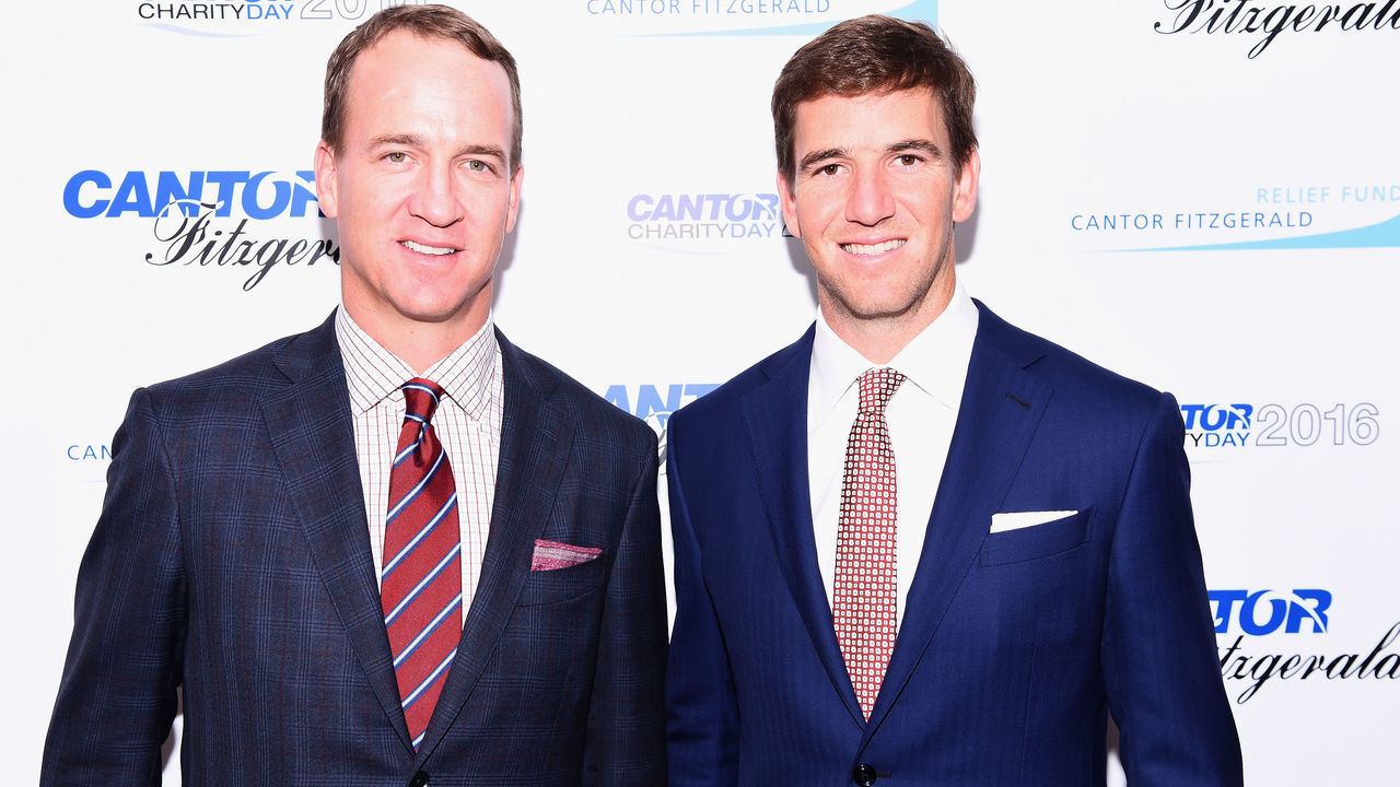 NEW YORK, NY - SEPTEMBER 12: Former NFL player Peyton Manning and NY Giants, NFL player Eli Manning attend the Annual Charity Day hosted by Cantor Fitzgerald, BGC and GFI at Cantor Fitzgerald on September 12, 2016 in New York City.