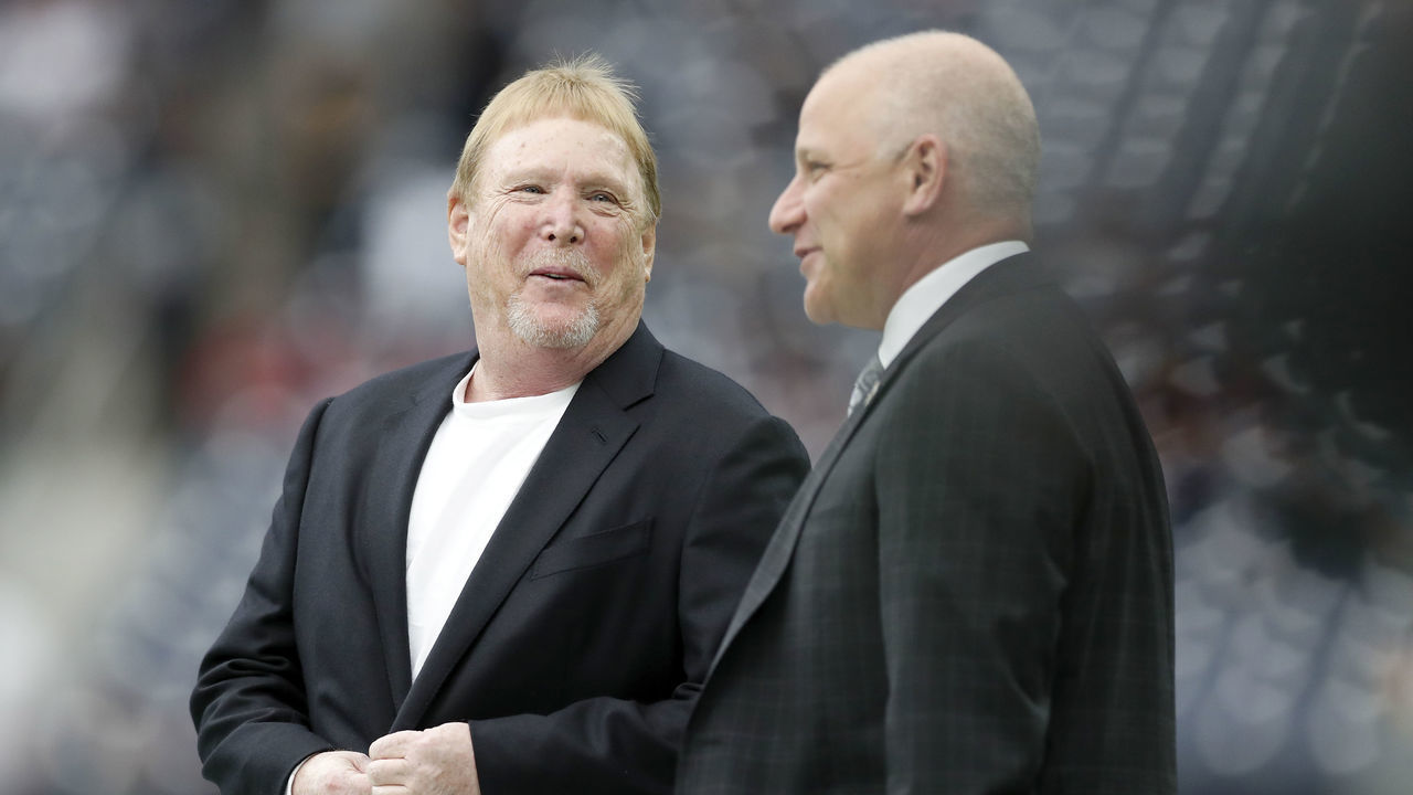 HOUSTON, TX - OCTOBER 27: Owner Mark Davis of the Oakland Raiders talks with team President Marc Badain before the game against the Houston Texans at NRG Stadium on October 27, 2019 in Houston, Texas.
