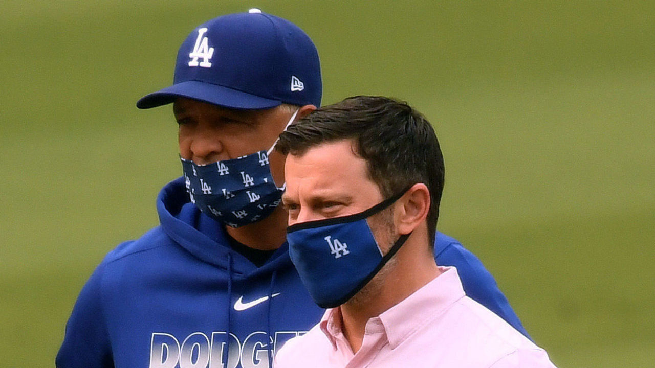 LOS ANGELES, CALIFORNIA - SEPTEMBER 12: President of Baseball Operations for the Los Angeles Dodgers, Andrew Friedman, and Manager, Dave Roberts, watch Joe Kelly #17 pitch before the game against the Houston Astros at Dodger Stadium on September 12, 2020 in Los Angeles, California.