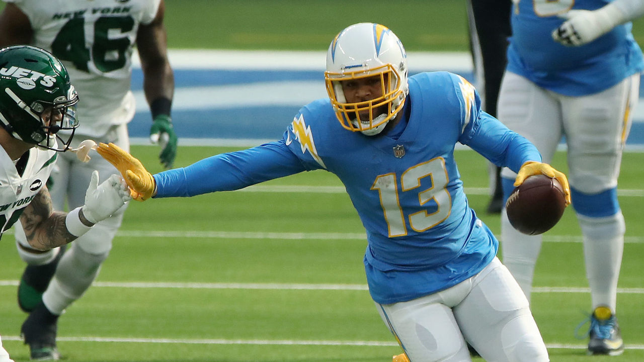 INGLEWOOD, CALIFORNIA - NOVEMBER 22: Keenan Allen #13 of the Los Angeles Chargers carries the ball as Ashtyn Davis #32 of the New York Jets defends during the first quarter at SoFi Stadium on November 22, 2020 in Inglewood, California.