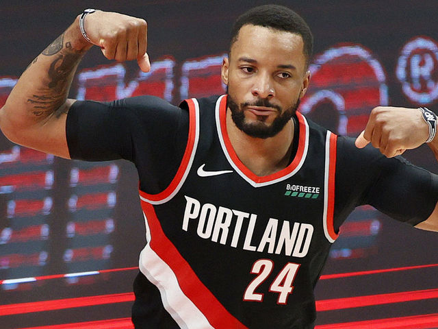 PORTLAND, OREGON - MAY 29: Norman Powell #24 of the Portland Trail Blazers flexes after his basket against Nikola Jokic #15 of the Denver Nuggets in the third quarter during Round 1, Game 4 of the 2021 NBA Playoffs at Moda Center on May 29, 2021 in Portland, Oregon.