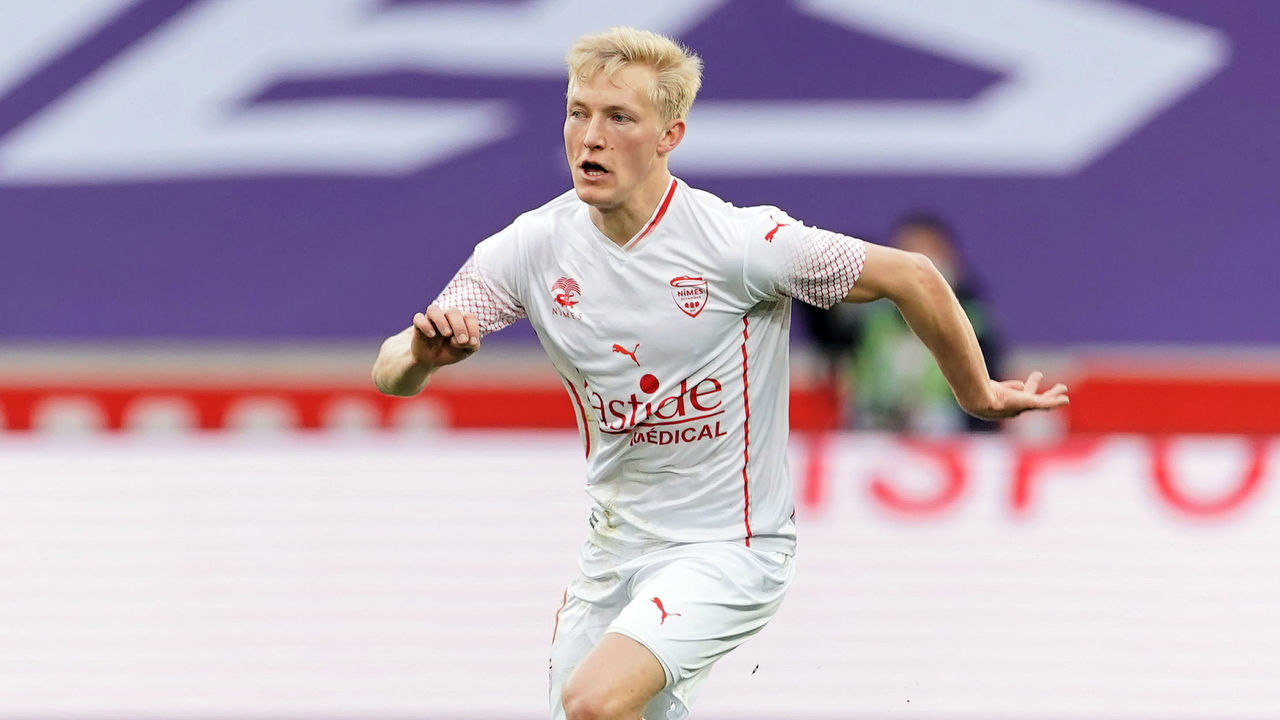 LILLE, FRANCE - MARCH 21: Birger Meling of Nimes Olympique runs with the ball during the Ligue 1 match between Lille OSC and Nimes Olympique at Stade Pierre Mauroy on March 21, 2021 in Lille, France.