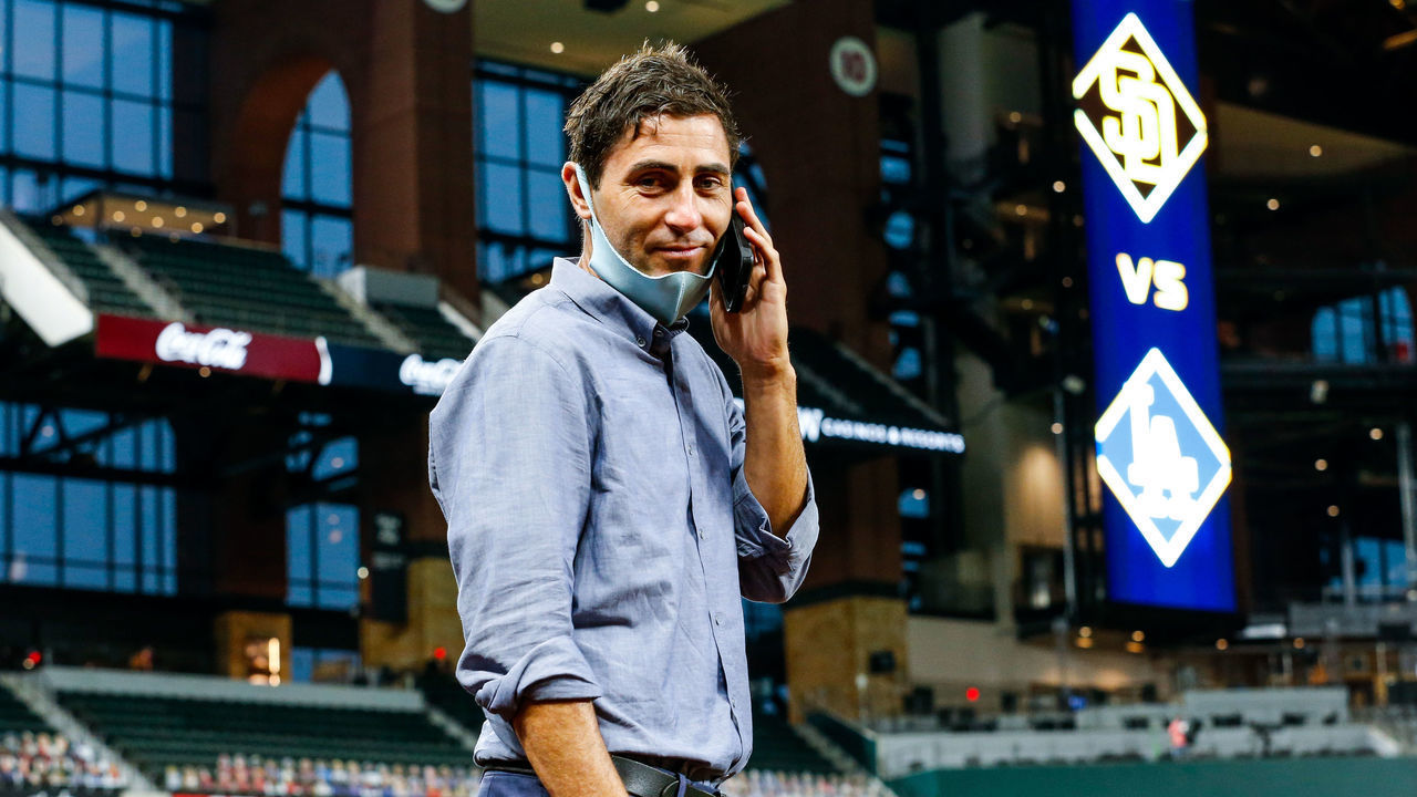 ARLINGTON, TX - OCTOBER 06: A.J. Preller, president of baseball operations for the San Diego Padres talks on his phone prior to Game 1 of the NLDS between the Los Angeles Dodgers and the San Diego Padres at Globe Life Field on Tuesday, October 6, 2020 in Arlington, Texas.