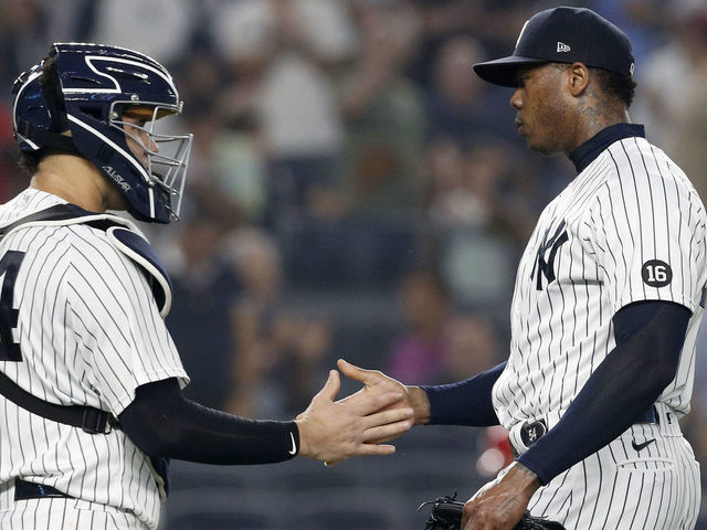 NEW YORK, NEW YORK - JULY 20: Aroldis Chapman #54 and Gary Sanchez #24 of the New York Yankees celebrate after defeating the Philadelphia Phillies at Yankee Stadium on July 20, 2021 in New York City.